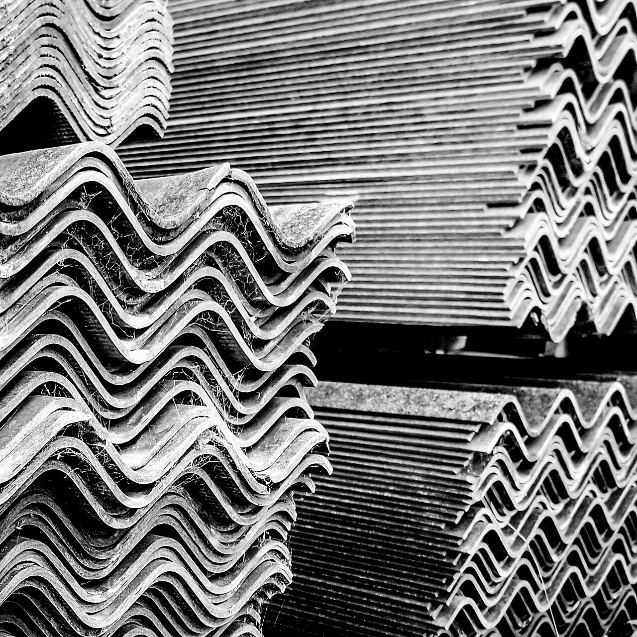 Grey corrugated asbestos-cement garage roof of the kind commonly priced for removal in the UK